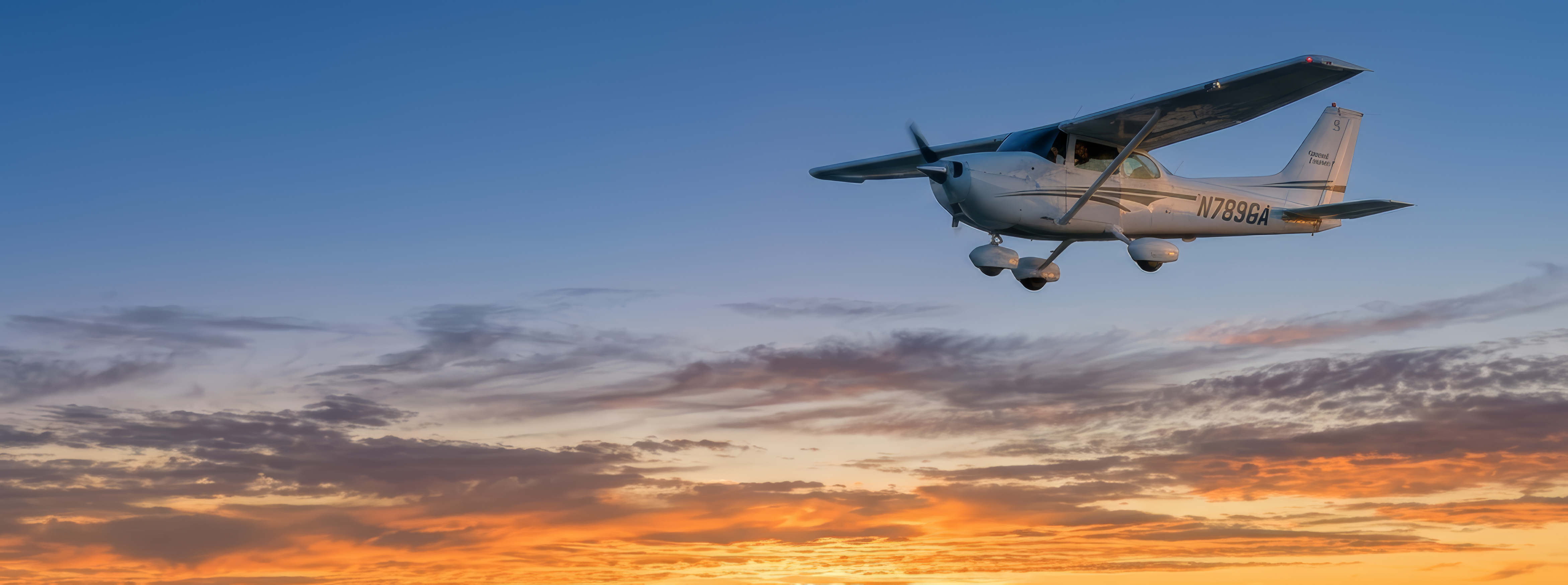 Cessna 172 in flight at golden hour
